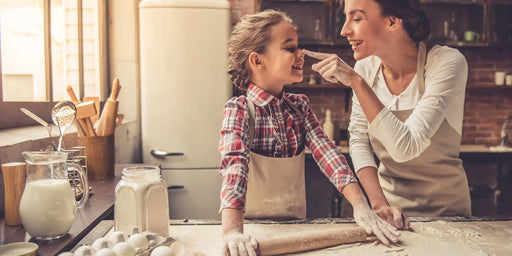 a mother and daughter baking in their pantry that is free from a pantry moth infestation.