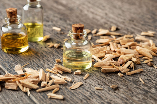 cedar chips with a bottle of cedar oil