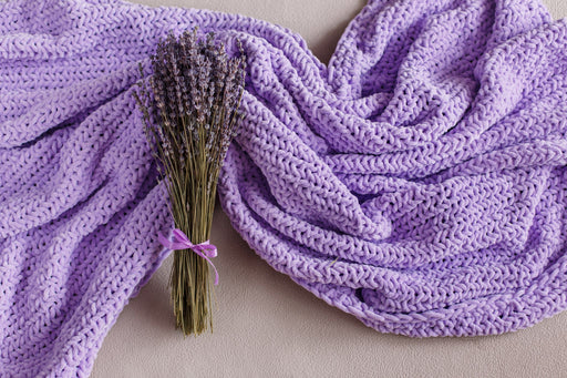 A bunch of lavender on a purple woolen blanket