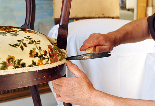 a chair being upholstered