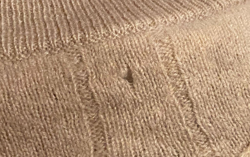another cashmere wool with holes caused by moth larvae 2