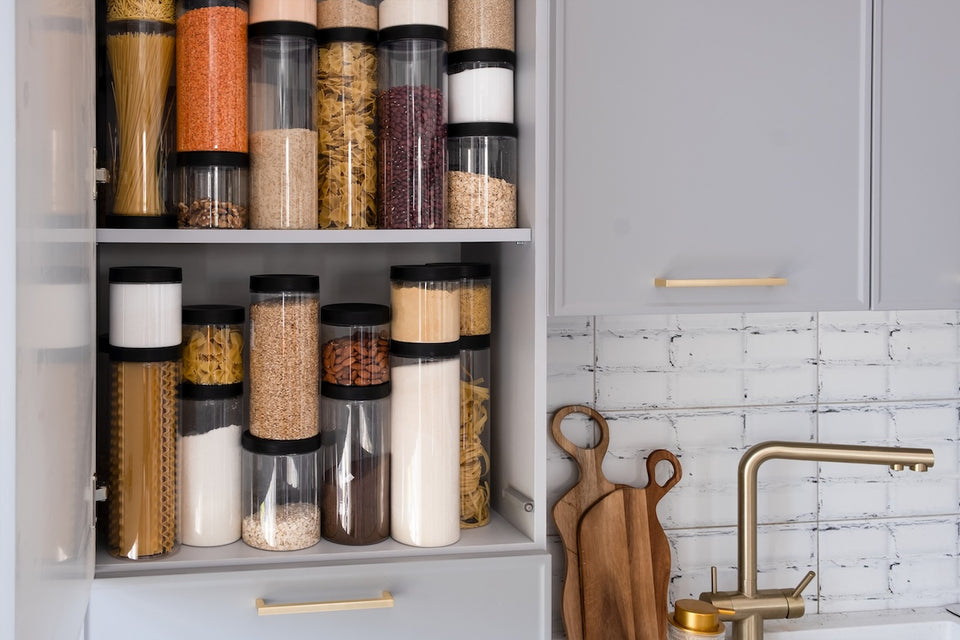 kitchen shelves with strong plastic containers full of dry foodstuffs