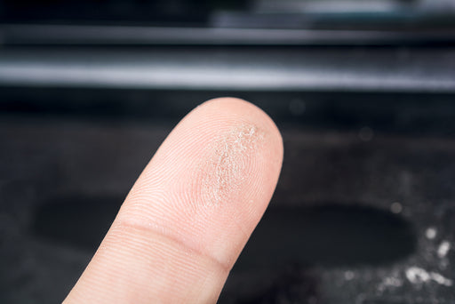 moth dust on someone's finger