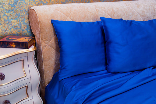 cobalt blue colored silk sheets with matching pillow cases