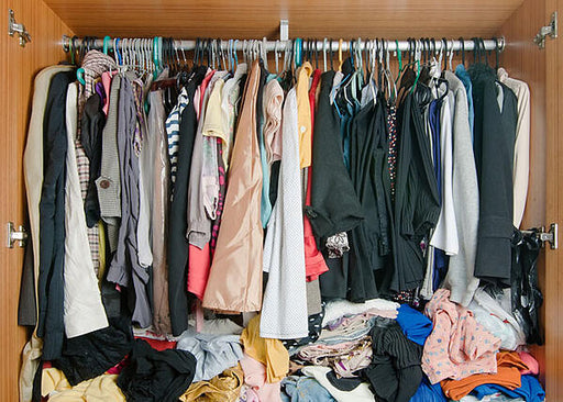 Messy closet wardrobe clothes moth larvae clothes moths