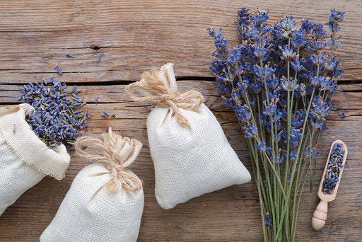 dried lavender being made into lavender bags