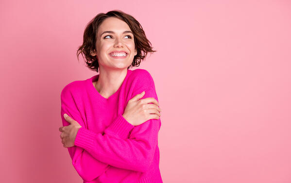 enjoying the feel of a quality sweater