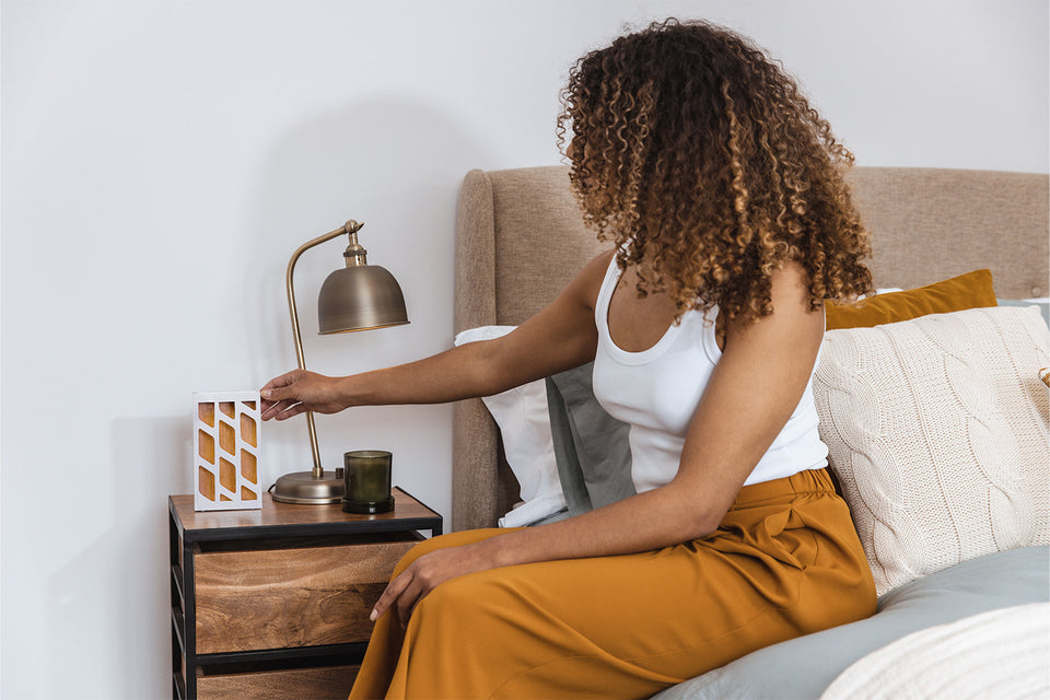 placing a MothPrevention Moth Trap by the bedside table